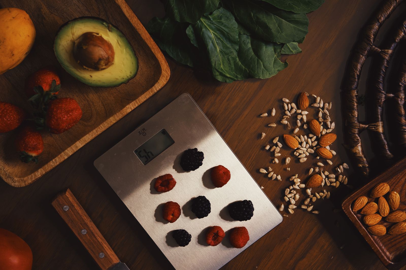 A spread of brain-friendly foods including berries, nuts and avocado.