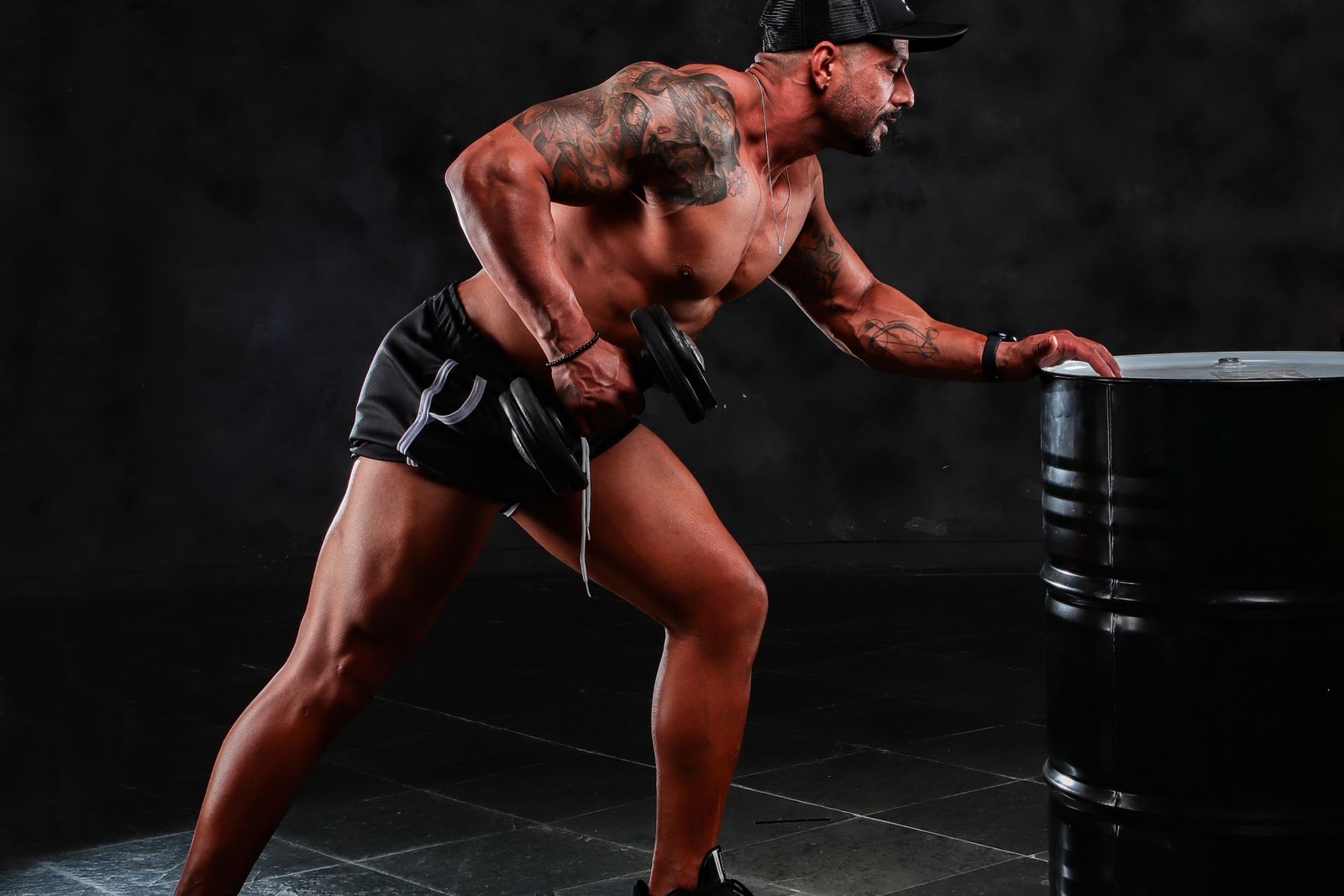 A person lifting a dumbbell during a strength training session.